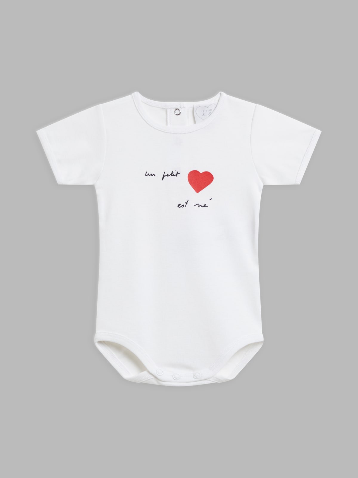 white cotton screen-printed "un petit cœur est né" (a little darling is born) bodysuit